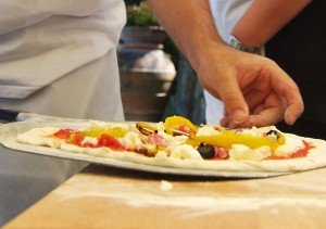 Making pizza on a cooking vacation in Italy