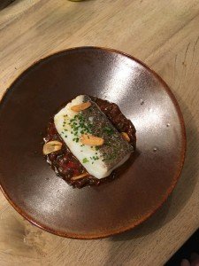 Fish dish in Barcelona enjoyed during a cooking vacation in Spain