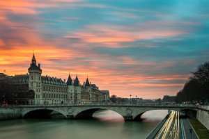 Sunset over the Seine River on a Paris culinary vacation.